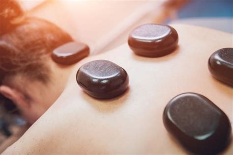 premium photo hot stone massage therapy back massage