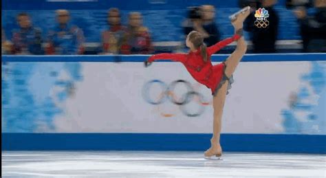 ice skater yulia lipnitskaya practicing spinning in the air from a standing jump s