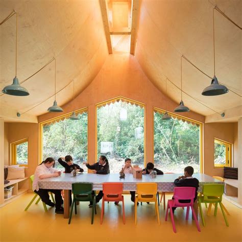 this fascinating wooden classroom opens up to a magical woodland