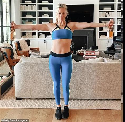 molly sims 46 shows off her abs in a bra top as she works out daily