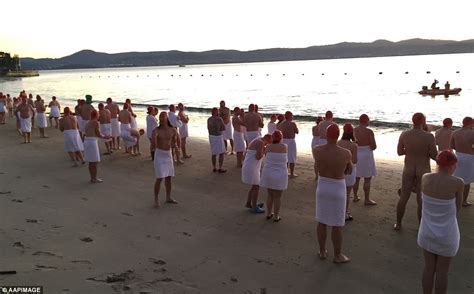 a dip at the crack of dawn hundreds of skinny dippers brave icy