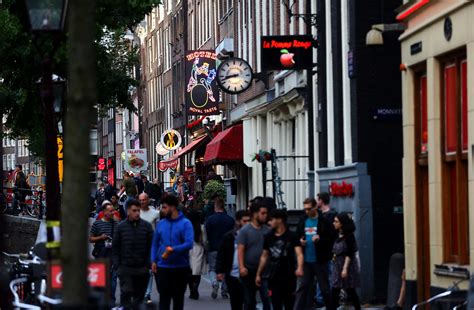 face to face contact banned as amsterdam s famous red light district