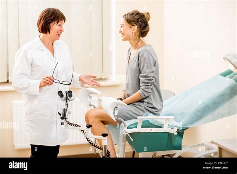 Young Woman Patient With A Senior Gynecologist During The Consultation