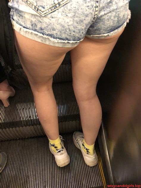 skinny ass in denim mini shorts hot and long legs subway escalator