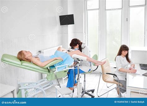 Professional Gynecologist Examining Her Female Patient On A