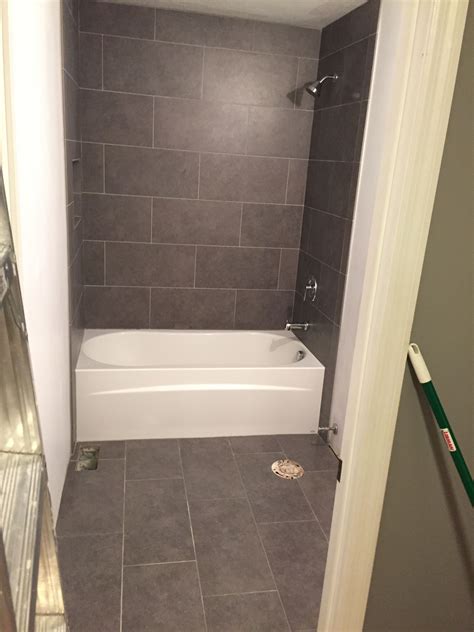 lowe s mitte gray tile 12x24 bathroom tub surround and floors bath