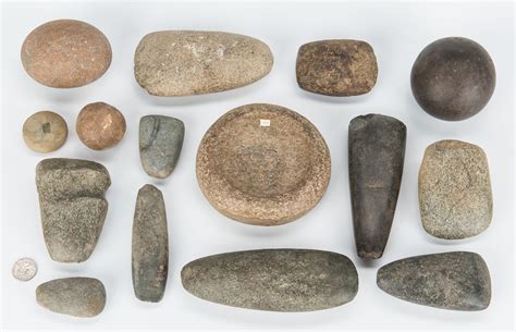 lot   native american stone artifacts  discoidals case