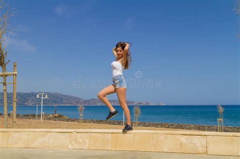 brunette teen in shorts enjoys the sun stock image image of spring summer 62071049