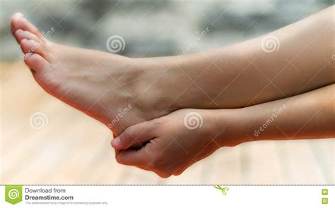 clean woman foot    hand touching  heel background