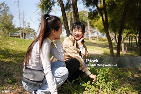 asian sisters enjoying  happy weekend outdoors stock photo