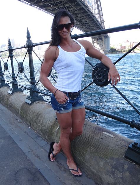 cindy landolt models her muscular arms and legs by the water female