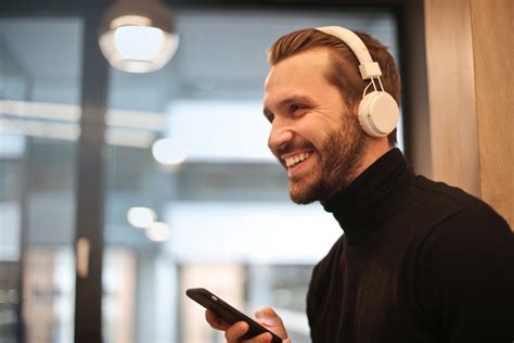 Free Photo Man Wearing White Headphones Listening To
