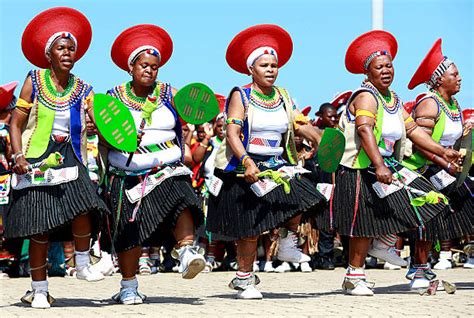 zulu dancers and singers dressed in traditionnal outfits perform during