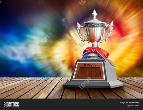 winner trophy  wooden table image photo bigstock
