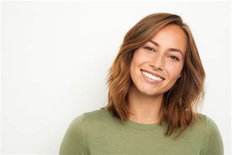 portrait   young happy woman smiling  white background goodman