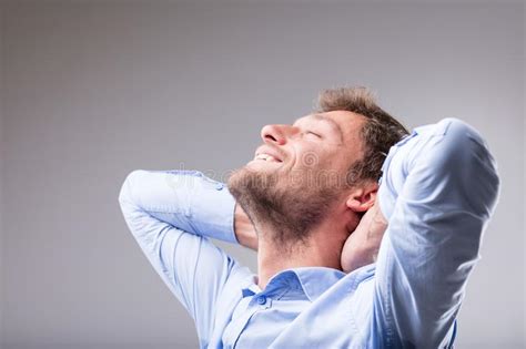 happy contented man relaxing   smile stock photo image  shirt