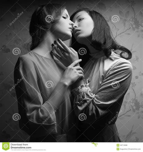 Retro Portrait Of Two Gorgeous Women Girlfriends Kissing