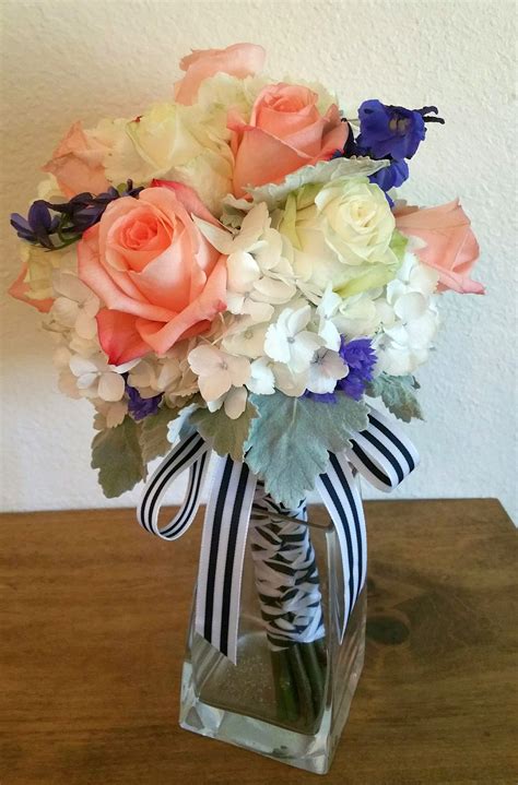 blue hydrangea and coral wedding bouquets a brides bouquet