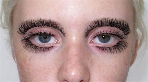 women  gluing fake eyelashes   eyebrows