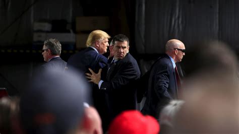 trump surrounded  secret service  man  rushing stage abc news
