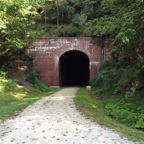 north bend rail trail in west virginia takes you through 10 abandoned train tunnels