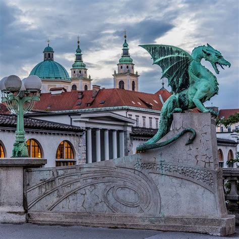 four large dragons guard ljubljana s dragon bridge in the capital of
