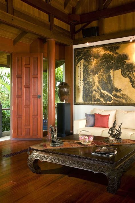 asian style living room   tall stained wood ceiling  wood carved coff asian