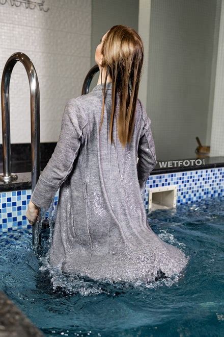 Sexy Woman Swims In Pool And Takes A Shower In Coat Overalls And Shoes