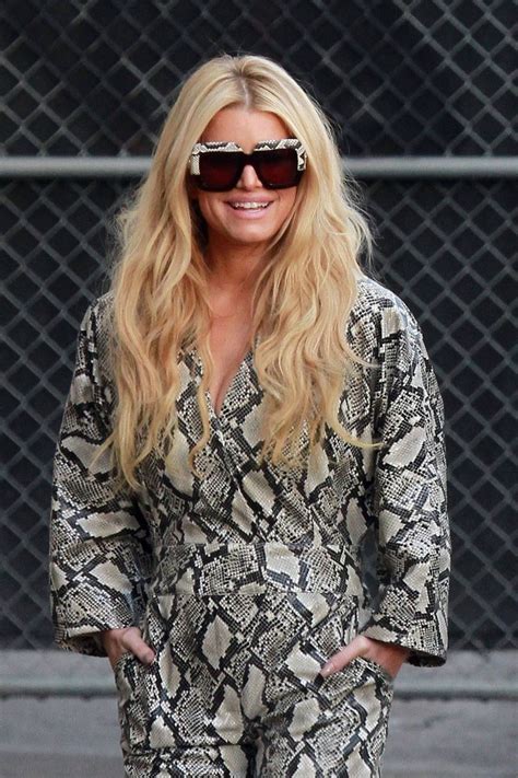 jessica simpson strikes a pose for photographers as she