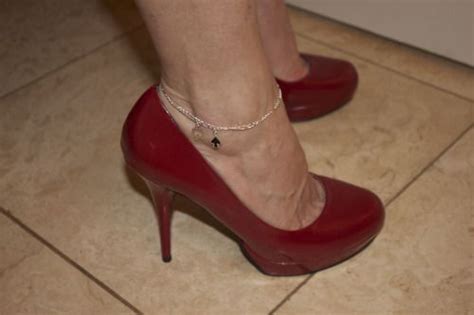 A Queen Of Spades Anklet Always Goes Well With Red Pumps