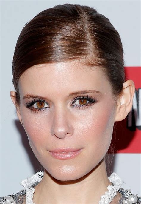 kate mara demonstrates two ways to wear a side parted updo which do