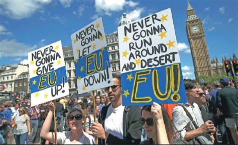 people hold banners during a march for europe demonstration against britain s decision to leave