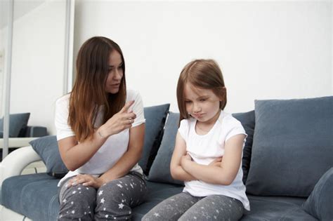 premium photo mother teaches daughter mom scolds girl
