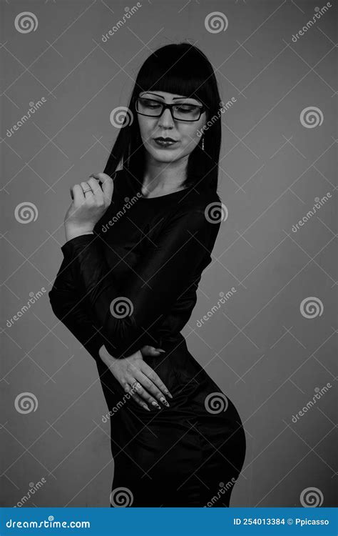 Portrait Of A Beautiful Girl With Glasses Posing For A Photographer In
