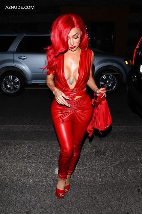 ana veronica arrives at toa in a fiery red leather jumpsuit aznude
