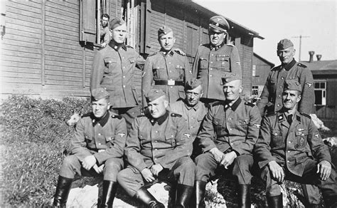 Group Portrait Of Ss Men With An Officer In Front Of A