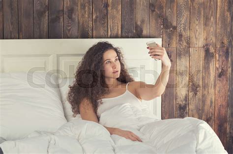Beautiful Girl Make Selfie Lie In Bed Stock Image Colourbox