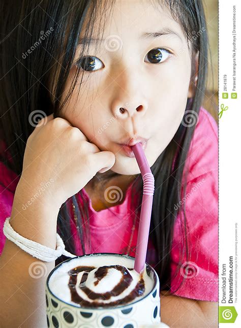 little asian girl enjoy a cup of chocolate shake stock image image 28141879