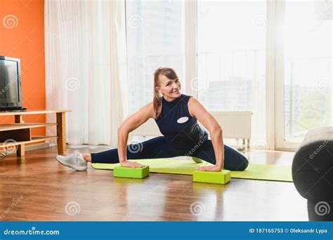 Mature Smiling Lady Stretching Legs At Home Stock Image Image Of