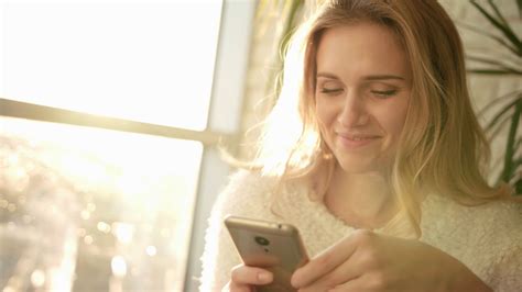smiling woman texting sms on smartphone stock footage sbv 323891144