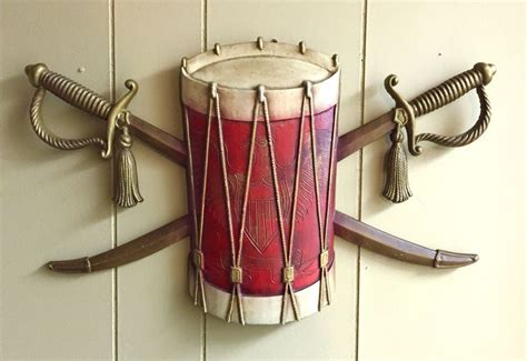 vintage wall hanging by sexton drum and swords with