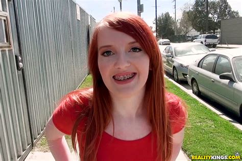 brace faced redhead works for extra money to top up her