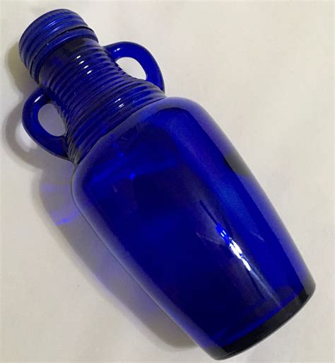 cobalt blue glass bottle  double handle  metal lid blue luna cafe