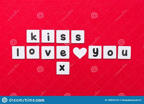 crosswords writing the words kiss love you and sex on red background