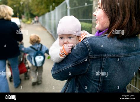 mother carries  baby girl stock photo alamy