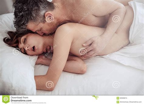 Man And Woman In Bed Having Intimate Sex Stock Image