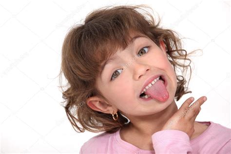 girl sticking tongue  stock photo image   photography