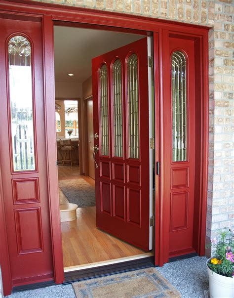 red front door  bold house exterior traba homes