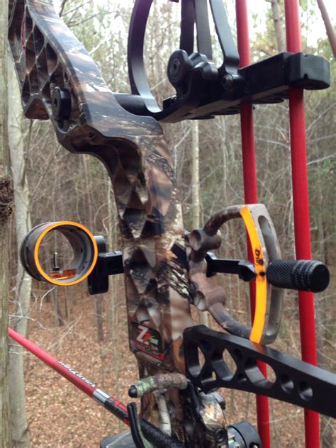 mathews z7 extreme equipped with an eap single pin sight and carbon express red sticks bow