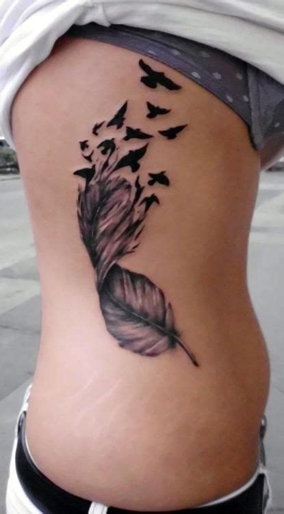 Pretty Feather Dissolving Into Birds Design Feather Tattoos Flame